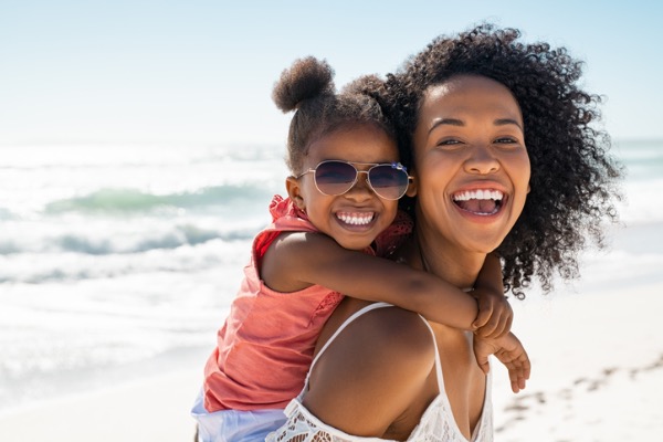 family smiling on vacation